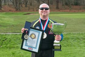 Paddy Doyle celebrating his 700-feat success at the finish at Atherstone Golf Club