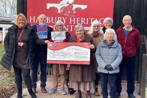 The cheque being presented to Myton’s community fundraising officer Louise Careless (left), with members of the Heritage committee and some of the artists. Photo supplied