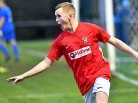 Scorer Max Johnson wheels away in delight