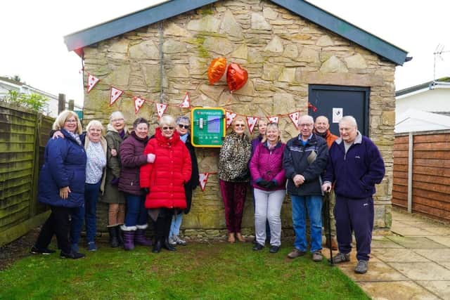 Members of the Redlands Park Residents Association in Lighthorne with the new defibrillator. Photo supplied