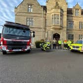Chair of Warwickshire Road Safety Partnership and Warwickshire Police and Crime Commissioner Philip Seccombe with the new road safety strategy with representatives from WFRS, police and National Highways in the background. Photo supplied