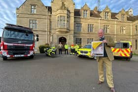 Chair of Warwickshire Road Safety Partnership and Warwickshire Police and Crime Commissioner Philip Seccombe with the new road safety strategy with representatives from WFRS, police and National Highways in the background. Photo supplied