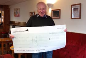 Nelson Social Club president Paul Stefani holding the cheque.  Photo supplied