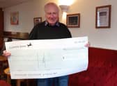 Nelson Social Club president Paul Stefani holding the cheque.  Photo supplied