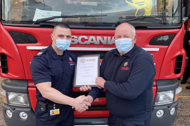 Steve (right) is presented with a certificate to mark his 39 years of service.