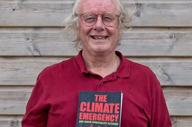 Chris Philpott with his book The Climate Emergency and Green Spirituality Activism- a Last Chance to Change our values