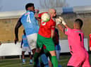 Jamal Clarke's header is punched clear