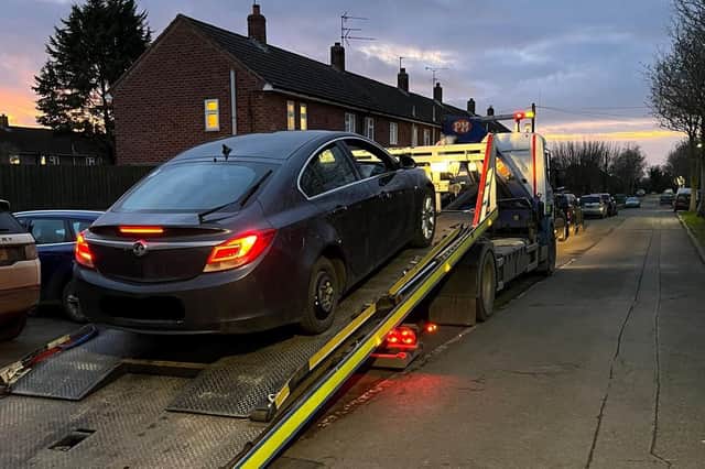 The Vauxhall Insignia was seized and the driver was reported for many offences. Photo by OPU Warwickshire.