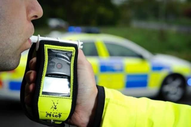 A suspected drink driver has been arrested after reversing her car into a ditch near Rugby.