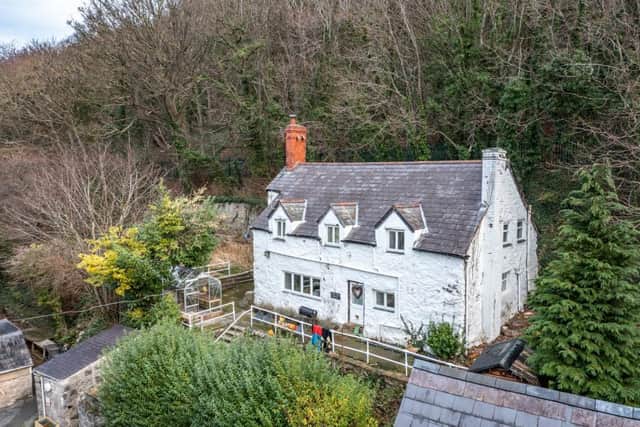 The Grade II listed cottage comes as part of the sale. Photo: Savills National Auctions.