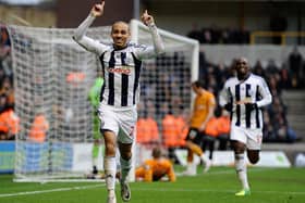 WOLVERHAMPTON, ENGLAND - FEBRUARY 12: Peter Odemwingie of West Bromwich celebrates the third goal during the Barclays Premier League match between Wolverhampton Wanderers and West Bromwich Albion at Molineux on February 12, 2012 in Wolverhampton, England. (Photo by Laurence Griffiths/Getty Images)
