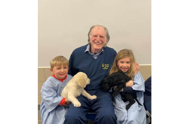 Rex Bradley, David Bradley and Illy Bradley with some of the puppies. Photo supplied