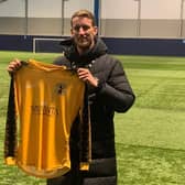 Carl Baker holds a Racing Club Warwick shirt,having been announced as their new Academy Football Manager