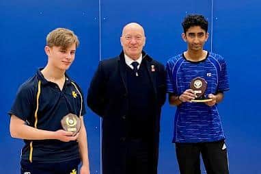 Under 19 boys Adam Shapiro (left) runner up; and Deva Bakthisaran (right) winner; with trophies presented by Kevin Taylor.