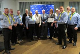 Members of the Warwick Rotary Club with members of the 2nd Warwick Sea Scouts. Photo supplied