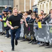 One of the members of the team from The Globe during the Pancake Day races
