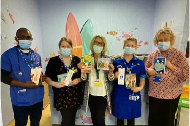 Caty Oates, from the charity ‘Kissing it Better’ kindly dropping off the books from the Leycester House care hometo the staff on the MacGregor Children’s Ward at Warwick Hospital. Photo supplied