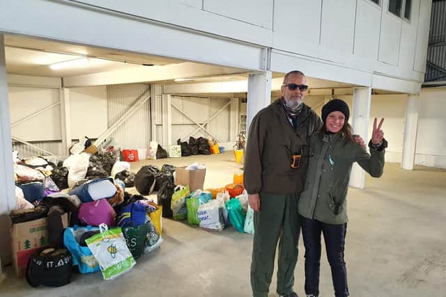 Natalia Loboda and Simon Jones of Harbury Lane Army Surplus in Leamington with the donated items made by pupils, parents and staff at Our Lady and St Theresa's Roman Catholic School in Cubbington at the new warehouse being set up as a drop-off and pick-up point to help the victims of the war in Ukraine and Ukrainian refugees.
