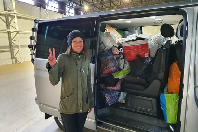 Natalia Loboda of Harbury Lane Army Surplus in Leamington with the donated items made by pupils, parents and staff at Our Lady and St Theresa's Roman Catholic School in Cubbington at the new warehouse being set up as a drop-off and pick-up point to help the victims of the war in Ukraine and Ukrainian refugees.