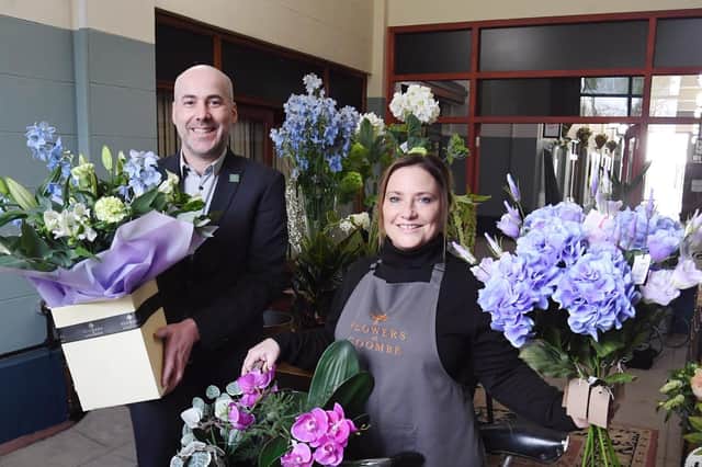 Robert Andrews and Candice McCann celebrating the opening of Flowers at
Coombe in the Visitor Centre at Coombe Abbey Park