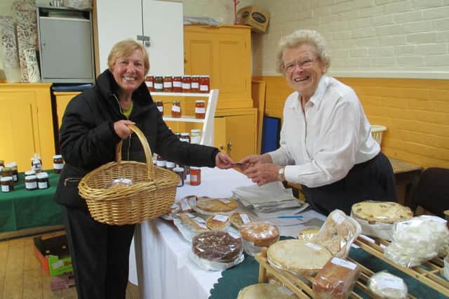 Christine Jones serving at Coleshill Country Market. Photo supplied