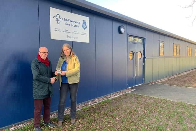 Matt presenting Janette Eslick with her award in front of the brand new Sea Scouts HQ.