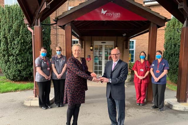 Myton Hospices caption: Matt Western MP presents the award to Charlotte Ingram, Director of Income Generation and members of the frontline medical team at Myton.