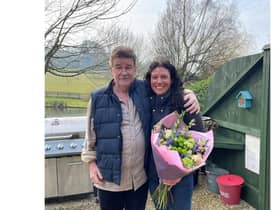 Steve Taylor presented Pip Blair with a bouquet during an emotional reunion at
Winchcombe Farm, a holiday retreat he runs with his wife Jo Carroll, in Upper Tysoe. Photo supplied