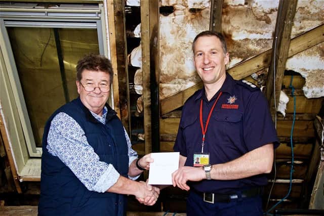 Steve Taylor presents Andy Paxton with a cheque. Photo supplied