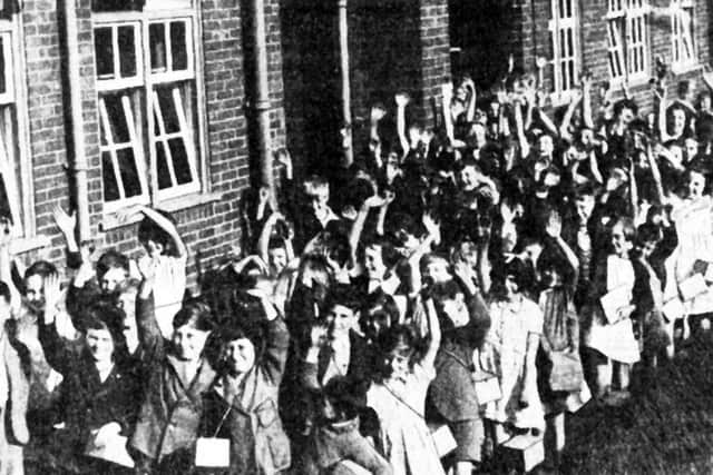 Schoolchildren, evacuated from Coventry the day war was from declared, carrying their gas masks arrive for their first day at St Nicholas school, on 11th September 1940.