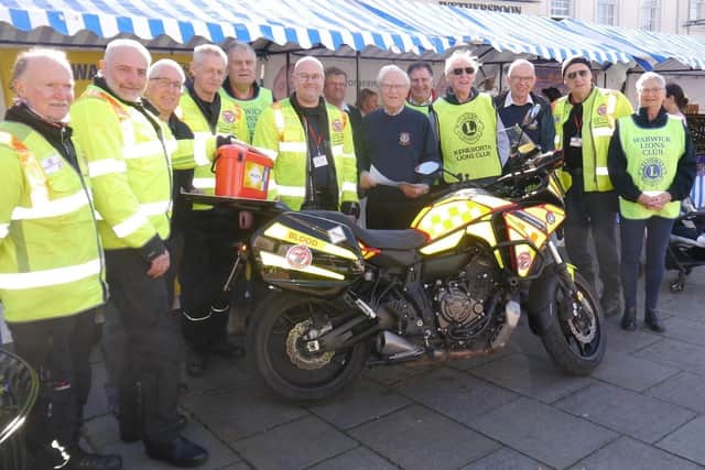Members of Kenilworth and Warwick Lions Clubs with the Warwickshire and Solihull  Blood Bikers at Warwick Market. Photo supplied