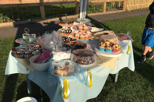 Table full of cakes sold by 8-year-old William from Kineton to help the Ukrainian refugees
