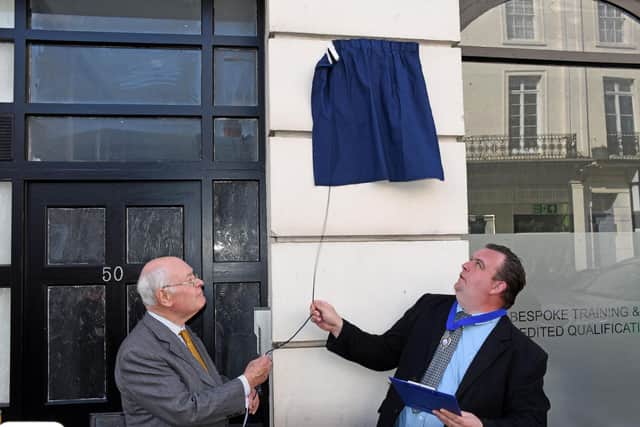 The plaque for Margaret Fowler OBE  is unveiled in Bath Street. Photo by Allan Jennings.