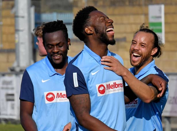 Justin Marsden (right) celebrates his double with Jamal Clarke (centre)