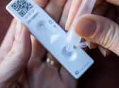 Reminding people to stay aware of coronavirus symptoms and to take lateral flow test