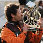 Sam Waley-Cohen kisses the Grand National trophy he dedicated to his late brother, Thomas. Picture by Getty