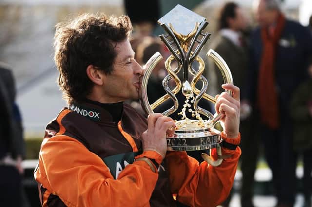 Sam Waley-Cohen kisses the Grand National trophy he dedicated to his late brother, Thomas. Picture by Getty