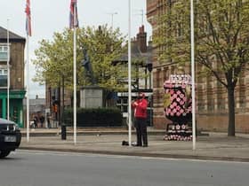 A Rugby ranger flies the Union flag at half mast.