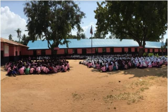 School assembly at Vingujine Primary school showing new and old classrooms. Photo supplied