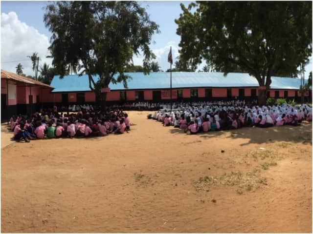 School assembly at Vingujine Primary school showing new and old classrooms. Photo supplied