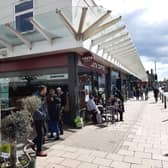 Enjoying a drink in the sunshine outside Costa.