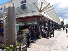 Enjoying a drink in the sunshine outside Costa.