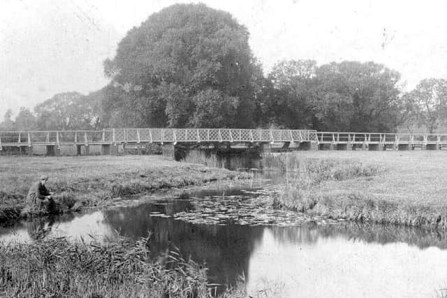An angler tries his luck near the Wooden Bridge in this archive shot.