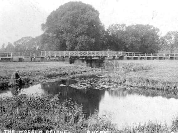 An angler tries his luck near the Wooden Bridge in this archive shot.