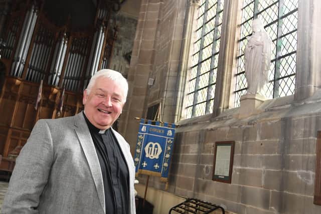Reverend Vaughan Roberts, Vicar of the Collegiate Church of St Mary and Team Rector of Warwick, with a statuette of the Virgin Mary, to whom St Mary's is dedicated and who the Order of St Mary is named after. Photo supplied