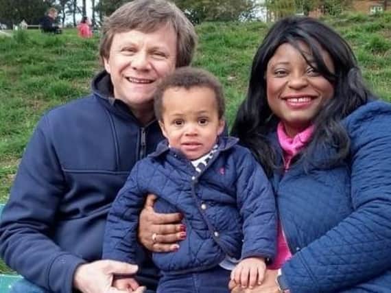 Kenilworth lawyer Amina Brooks with her husband Tony and son James.
