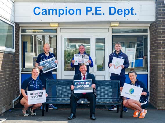 Campion School's assistant headteacher Jonathan Blower (centre) and fellow school staff promote the Missing People charity.