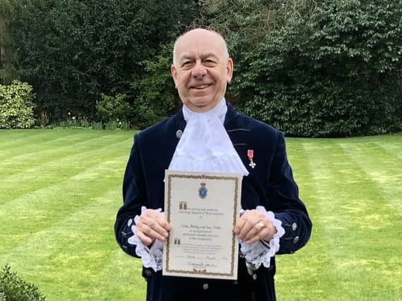 Joe Greenwell with one of the High Sheriff Awards presented to council staff for work carried out during the Covid-19 pandemic.