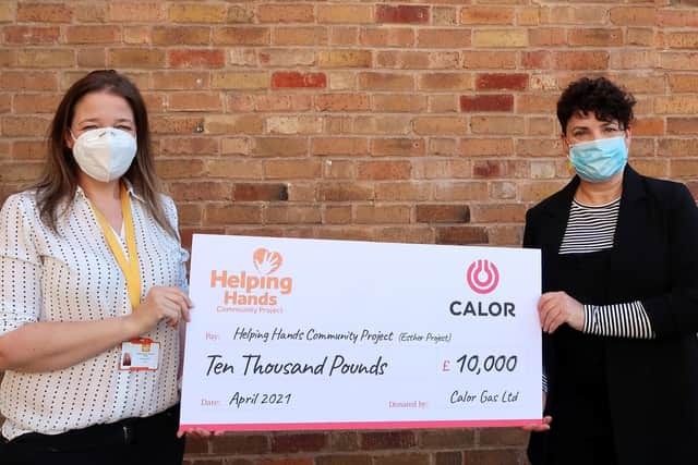 Lianne Kirkman, CEO at Helping Hands Community Charity receiving the donation from Susann Gallion, PA to marketing and sales Director at Calor. Photo supplied