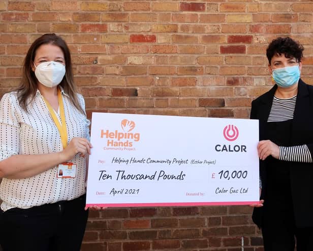 Lianne Kirkman, CEO at Helping Hands Community Charity receiving the donation from Susann Gallion, PA to marketing and sales Director at Calor. Photo supplied